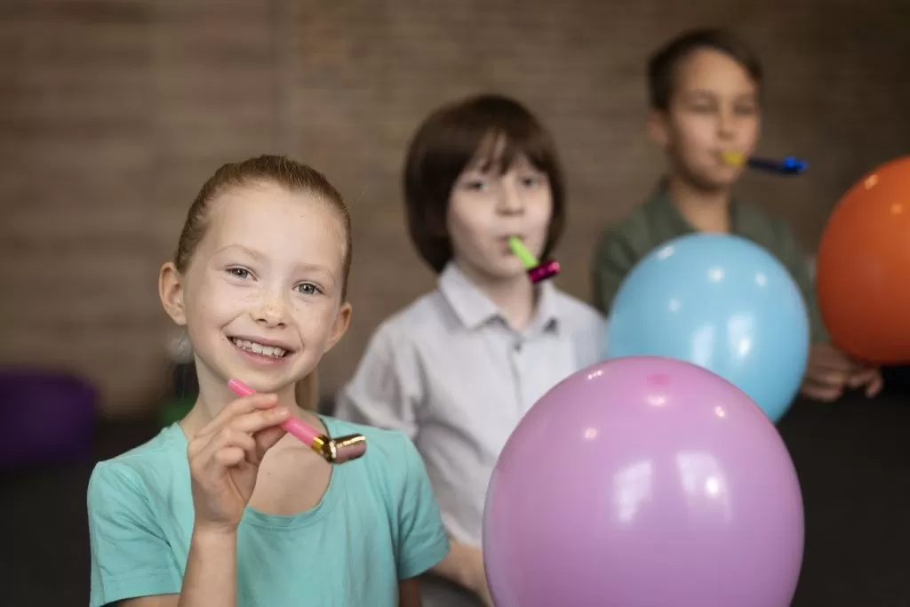 medium-shot-kids-playing-with-balloons.jpg